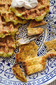 Zucchini waffles with roast turkey on ceramic plate