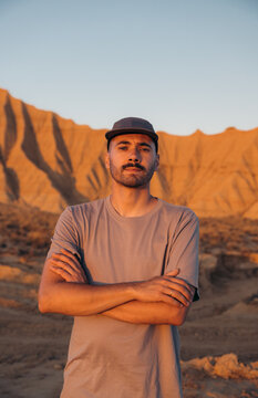 Man with crossed arms in Bardenas Reales desert, Spain