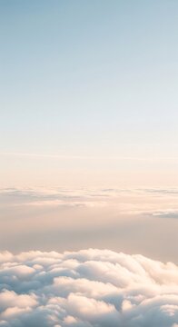 Aerial view above the clouds with soft pastel pink and blue sky during sunrise or sunset. Fluffy white clouds background, peaceful dreamy atmosphere, heavenly serene flight window view.