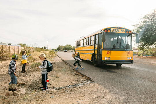 Kids Getting off School Bus in the Desert