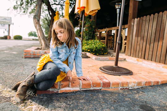 Moody Girl sitting in Park
