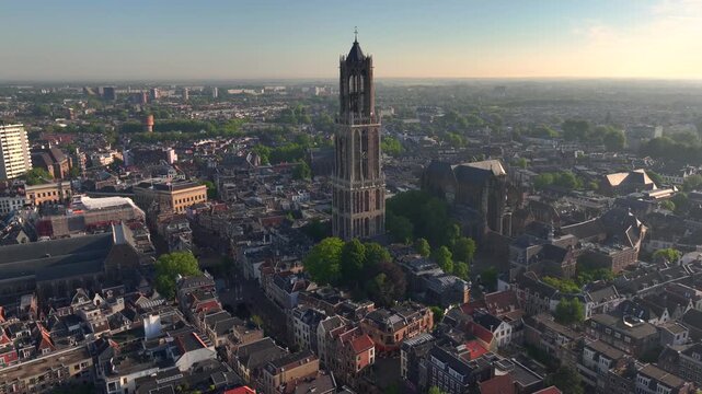 Utrecht City in morning light. Sunrise in the Netherlands. Dom Tower of Utrecht Aerial View, Sunny Dutch City Skyline.
