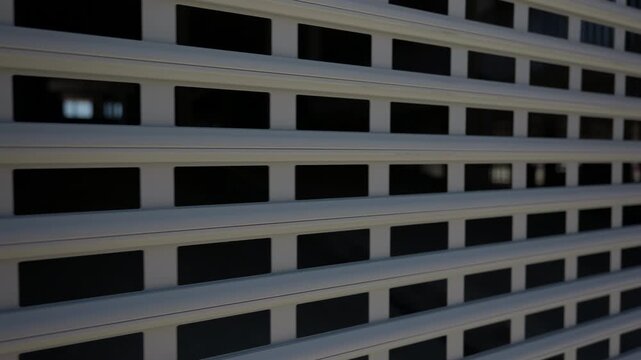 Metal security gate at entrance to residential parking garage