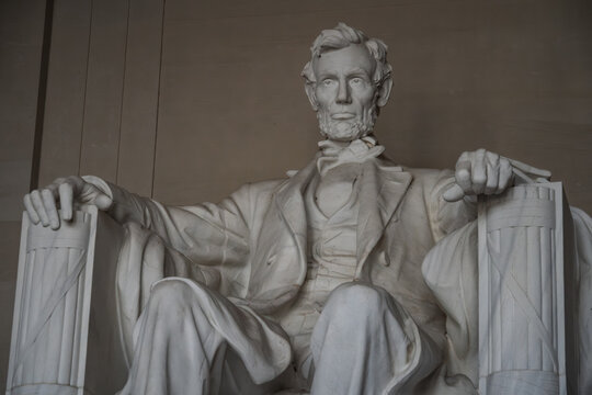 View of the Lincoln Memorial statue of Abraham Lincoln, a large marble sculpture of the seated president in Washington, District of Columbia, United States.