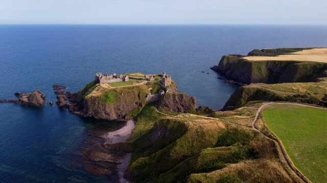 Dunnottar Castle Scotland Aerial View with Slow Rotating and Rising Drone Shot