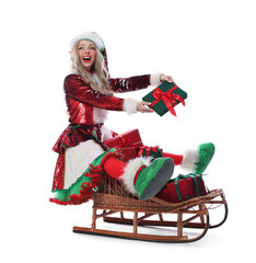 Naklejka premium Woman wearing elf costume on sledge full of Christmas gifts against white background