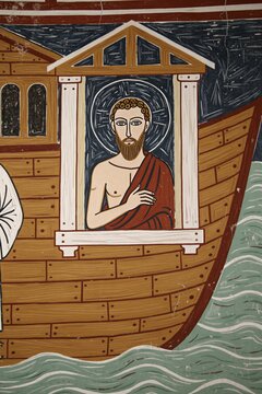 Ancient medieval fresco mural inside Saint Pierre church in Moutiers en Puisaye France. Biblical art shows Noah inside wooden ark during Great Flood. Religious wall painting features holy man at