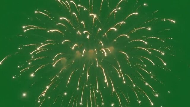 Fireworks exploding brightly with golden trails isolated on green screen background for video editing and professional motion graphic projects