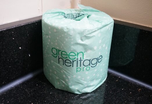 Atlantic City, New Jersey, U.S.A - Aug 16, 2026 - The eco-friendly Green Heritage Pro toilet paper roll wrapped in green packaging on a black countertop.