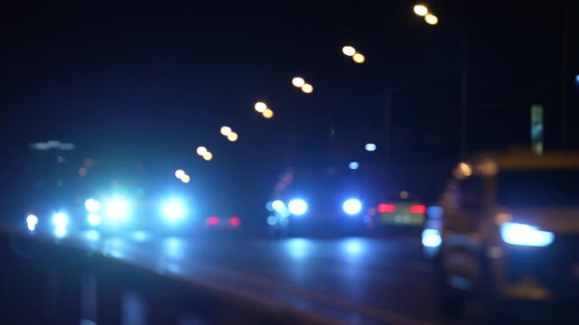 Night city traffic with blurred headlights and moving vehicles on urban road, cinematic transportation background showing modern mobility, commuting and city life