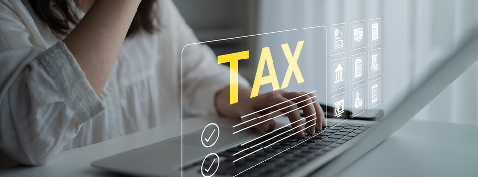 A woman is preparing her taxes on a laptop, with digital elements featuring tax icons, illustrating the intersection of technology and finance in personal management. Cyphers