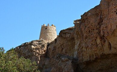 Traditional Ancient Stone Tower Structure in Rocky Desert Landscape © mohamed alhamami