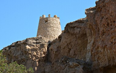 Traditional Ancient Stone Tower Structure in Rocky Desert Landscape © mohamed alhamami