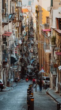 Spaccanapoli Napoli street with people and houses typical traffic