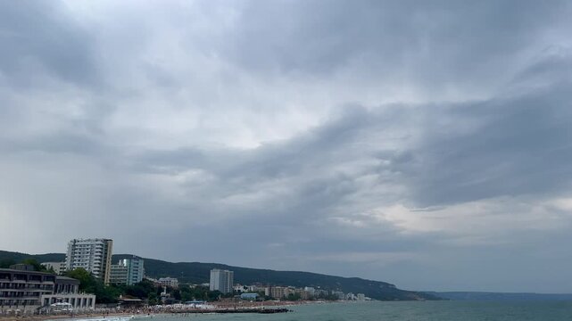 Gloomy overcast sky moving above a coastal resort town