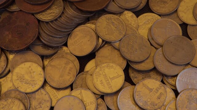Old Brazilian Cruzeiro coins for sale at an antique market stall. Numismatics. Coins for sale to collectors