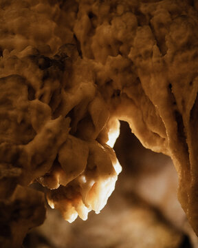 View of intricate limestone stalactites and rock formations inside the illuminated chambers of Postojna Cave in Postojna, Postojna, Slovenia.