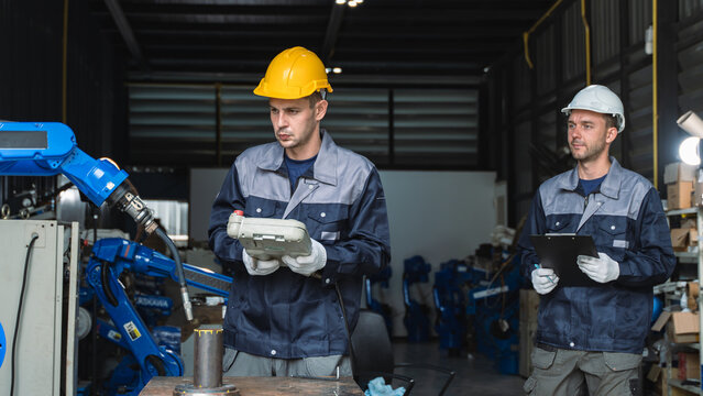 Industrial Workers inspecting robotic components While Evaluating Automated Machinery and Robotic Equipment Scene 285