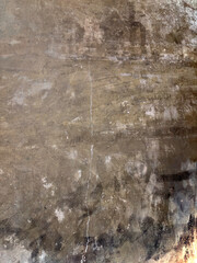 Fototapeta premium Swirled Adhesive Marks on a Stripped Brown Concrete Floor