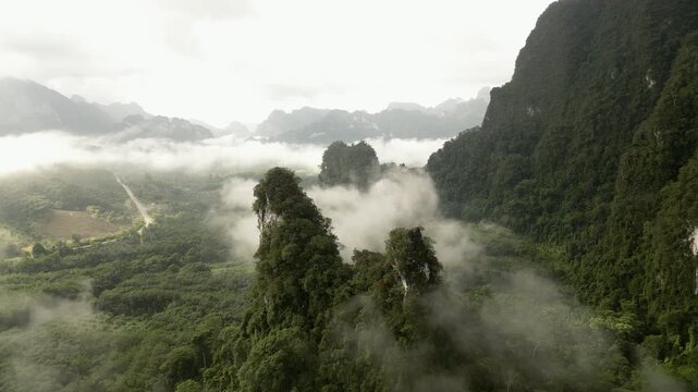 Misty Limestone Mountains and Tropical Rainforest in Khao Sok, Thailand
