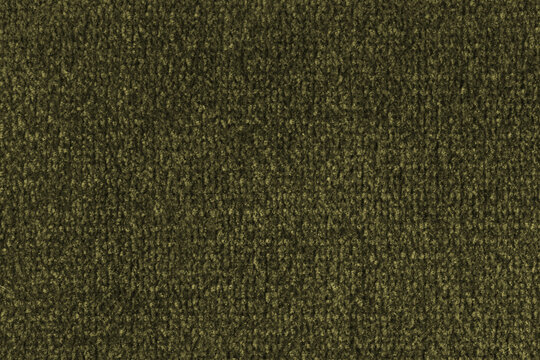 Close up, macro of khaki fabric texture with soft velvet, fluffy woven surface, microfiber textile detail. Knitted jersey cloth background, backdrop, wallpaper for design, fashion or interior