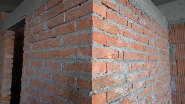 Interior finishing work in progress showing high quality brickwork and precise mortar joints.