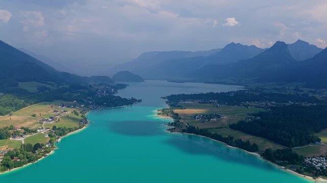 Nature alp landscape. Alp lake in scenic nature. Scenic nature alp hiking lake. Wilderness adventure at forest with lake. Alp green landscape. Landscape of idyllic forest at lake. Mountain range