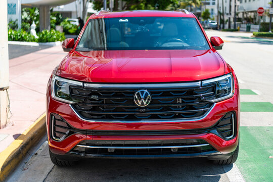 Miami, Florida, USA - May 13, 2025: Volkswagen Atlas or Atlas Cross Sport 2024 crossover SUV car. Luxury crossover car Volkswagen Atlas. Car Volkswagen Atlas parked outdoor. Red car, corner view