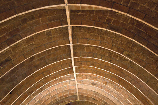 Arched Brick Vault Ceiling with Geometric Patterns