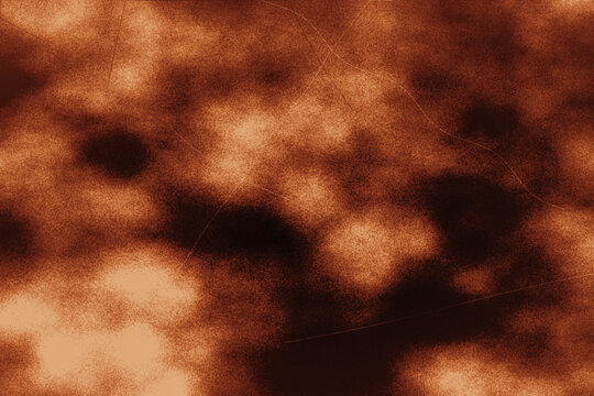 Abstract grunge background with burnt orange and dark brown textured smoky patterns for autumn graphic design projects.