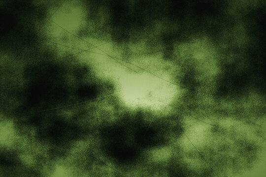 Abstract green dark texture with bright center and grunge effect suitable for dramatic backgrounds and graphic design projects.