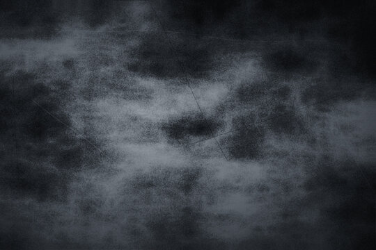 Abstract dark grey textured background with subtle scratch lines and smoky clouds for minimalist graphic design projects.