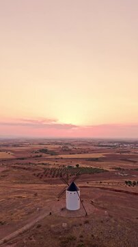 Traditional spanish windmill in la mancha at sunset