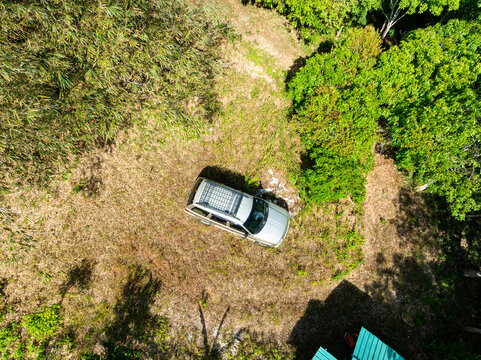 Aerial top view camping car in the forest