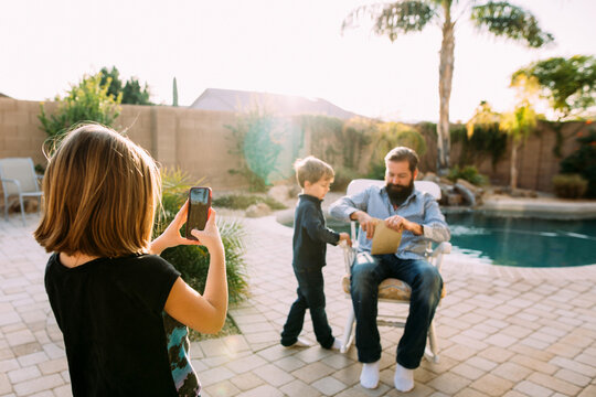 Father Getting Presents fron Children