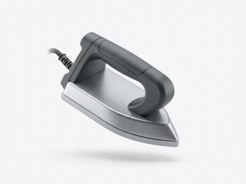 Modern grey electric clothes iron floating against a white background with electric, appliance