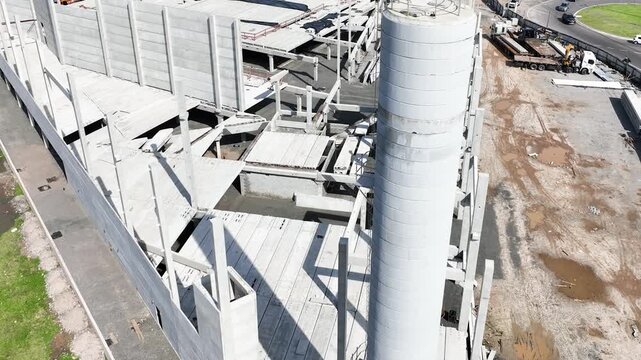 Modern Prefabricated Concrete Building Under Construction with Precast Columns Wall Panels and Hollow Core Floor Slabs, Aerial View