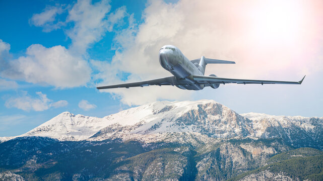 Silver Commercial Airplane Flying Over Snowy Mountains Against Turquoise Sky &mdash; 3D Render