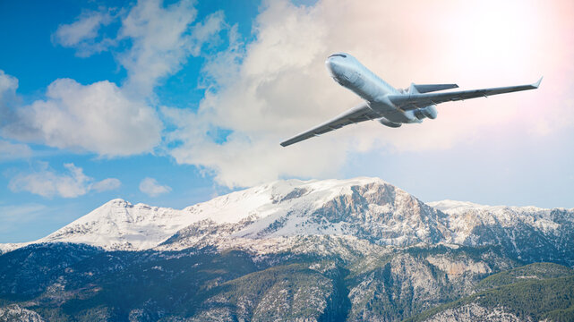 Silver Commercial Airplane Flying Over Snowy Mountains Against Turquoise Sky &mdash; 3D Render