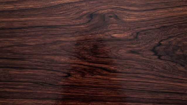 Dark wood texture with swirling grain pattern, natural brown background
