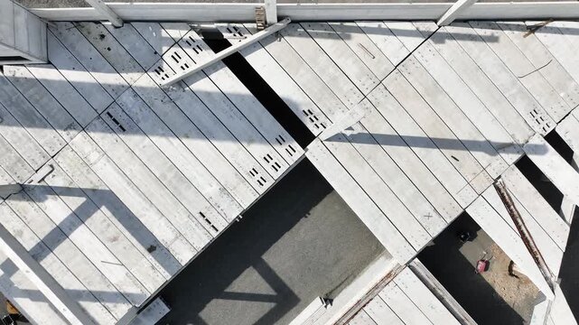 Modern Prefabricated Concrete Building Under Construction with Precast Columns Wall Panels and Hollow Core Floor Slabs, Aerial View