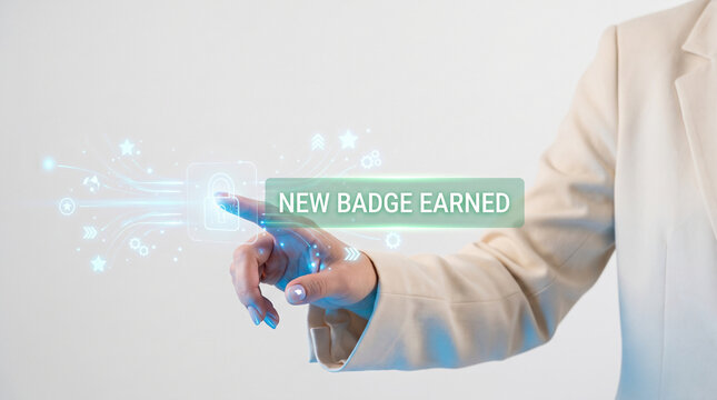 Professional business person interacting with a digital interface showing a new badge earned notification representing microlearning analytics and gamification in corporate training.