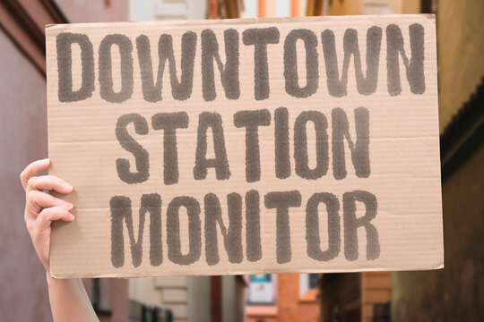 "Downtown Station Monitor" Overseeing urban voting location assignment. DOWNTOWN. STATION. MONITOR. OVERSEEING. URBAN.