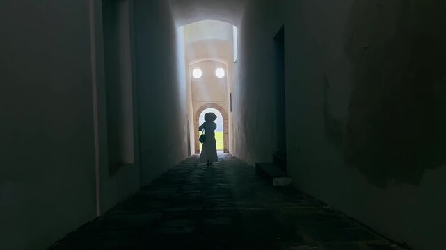 Woman Walking Through Museum Corridor on Capri Island Italy
