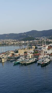 Boats Docked in Historic Marmaris Port with Coastal Town View