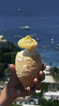 Woman Eating Refreshing Lemon Sorbet on Scenic Capri Island