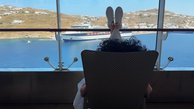 Tourist Woman on Cruise Ship Enjoying View of Mykonos Greece