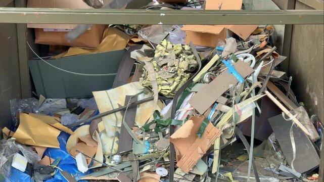 Mixed industrial and household waste sorted for recycling in a waste management facility, supporting circular economy and sustainable resource conservation.