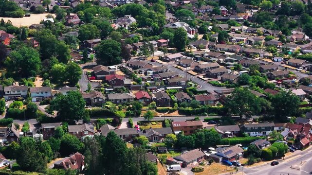 Drone shot over a leafy suburban neighbourhood of bungalows and family homes near Romsey.