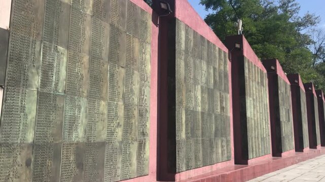Memorial Wall in memory of those killed during the Great Patriotic War, located in Vladivostok, Russia. The metal plaques with the names of the fallen soldiers are a significant city landmark